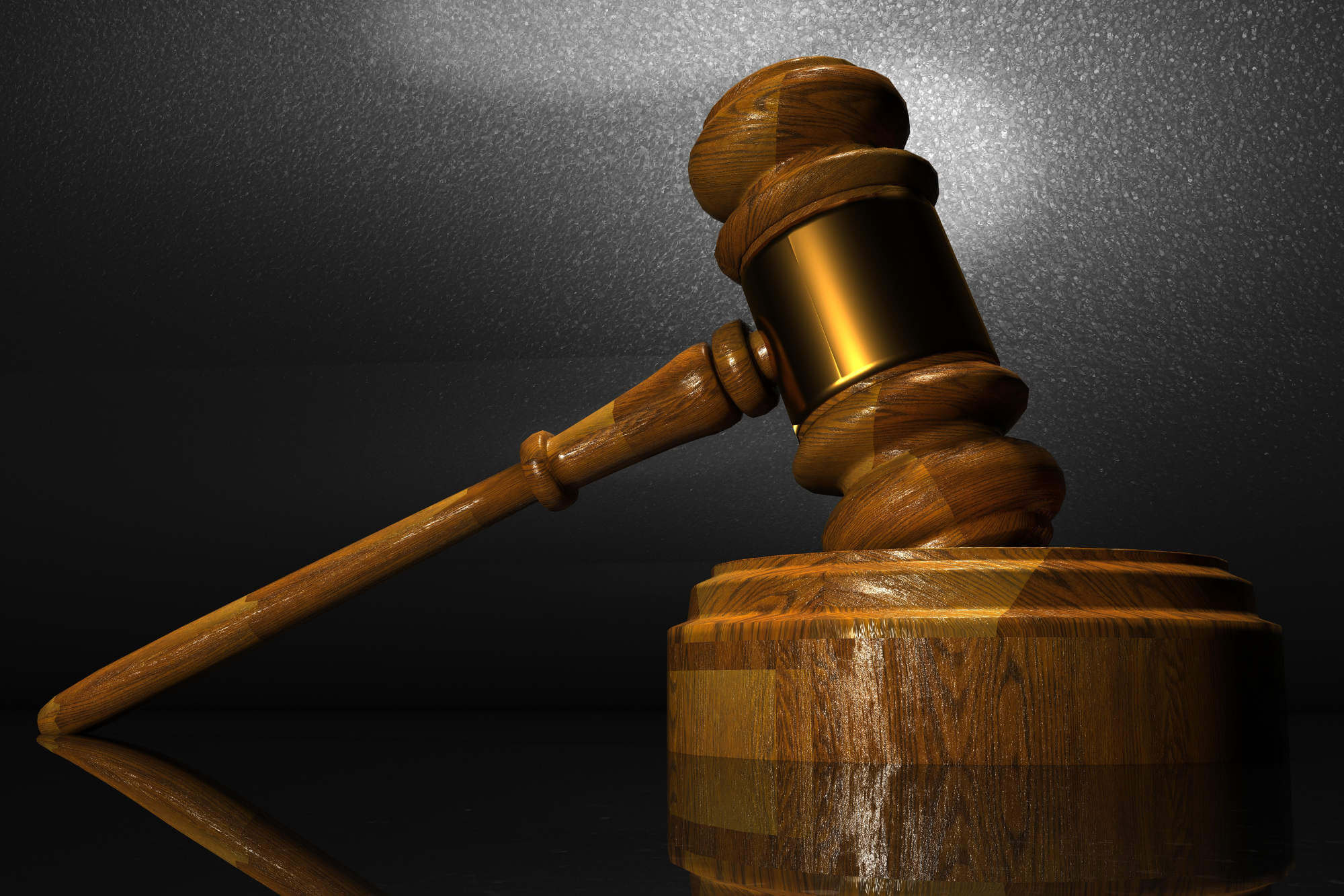 Judge's gavel isolated on dark background